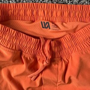 Performance Orange Elastic Waist Athletic Shorts, with front zip pocket!